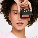 NARS_SU24_Blush_PDPCrop_Modelholdingproduct_Orgasm_GLBL (1).webp